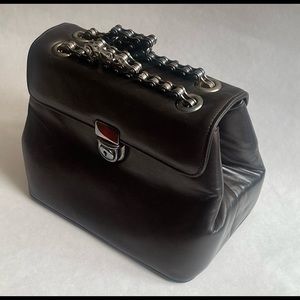 Fevrier leather ladies handbag, with bicycle chain handles.